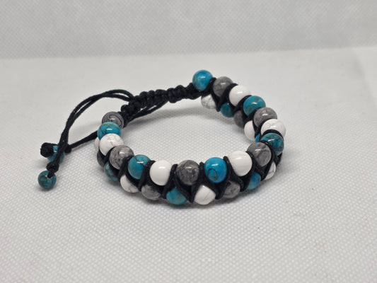 Turquoise, Howlite, and Jasper adjustable bracelet on a white background