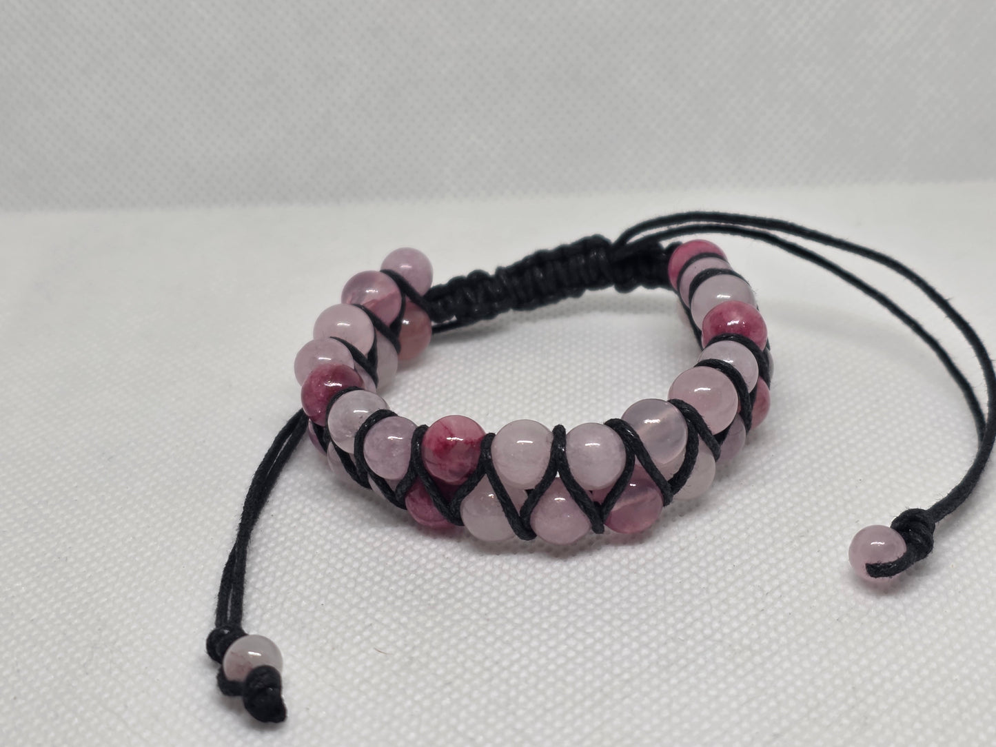 Persian agate, rose quartz, and kunzite double strand bracelet on a white background